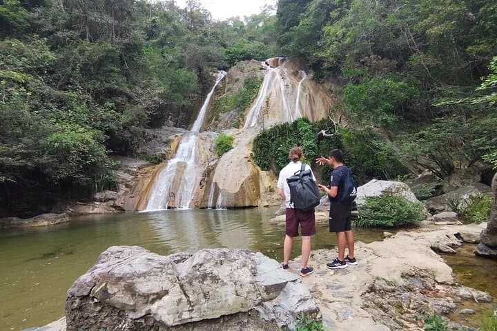 Natural adventure with waterfalls, trails and sunny day