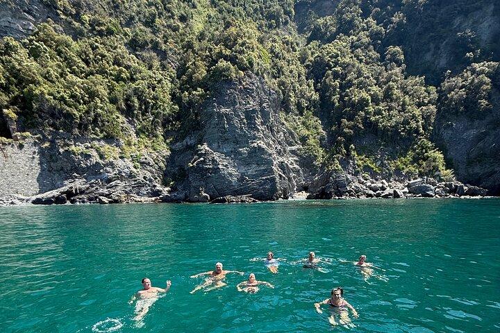 Boat ride from Riomaggiore with stop for swimming and local wine.